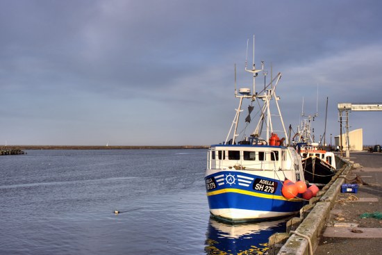 Fishing boats moored at Amble Harbour.