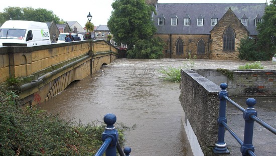 View of Telford Bridge, Morpeth - River Wansbeck in full flood.