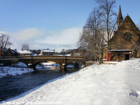 Snow on the banks of the River Wansbeck at Telford Bridge, Morpeth, Northumberland.