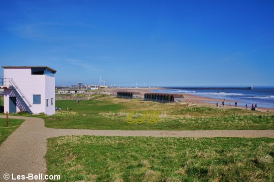 View along Blyth South Beach past a WW2 observation post at Blyth Battery.