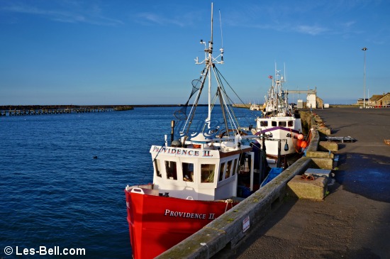 Fishing boats moored at Amble quayside.