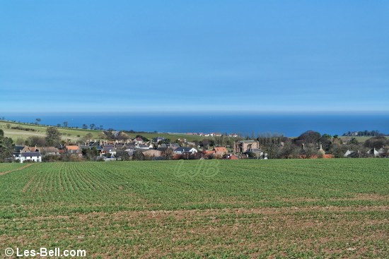 View across fields to Coldingham, Berwickshire, Scotland.