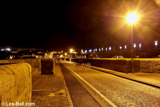 View along Berwick Old Bridge at night.