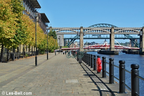 View along the riverside footpath to the High Level Bridge, Swing Bridge and Tyne Bridge.
