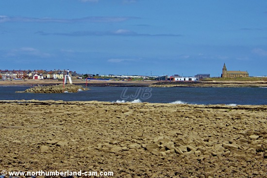 View across Newbiggin Bay to the Couple Structure on the breakwater and the Church Point.
