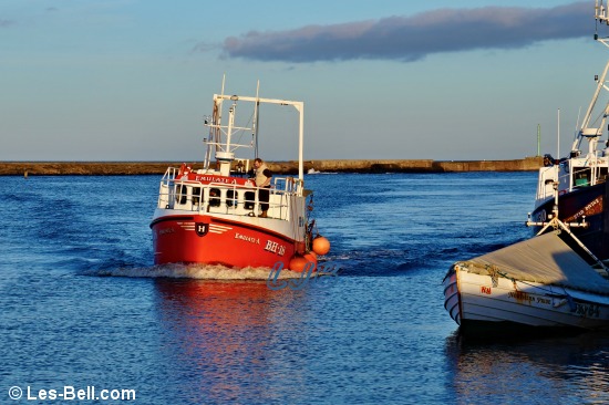 Fishing boat returning to Amble Harbour, Northumberland.