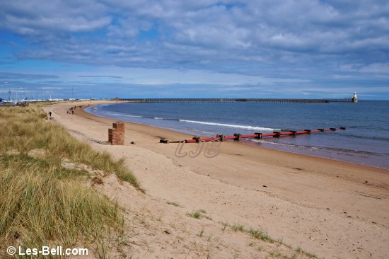 View along Blyth South Beach towards the piers.