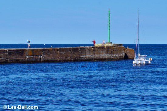 Yacht entering the River Coquet at Amble.